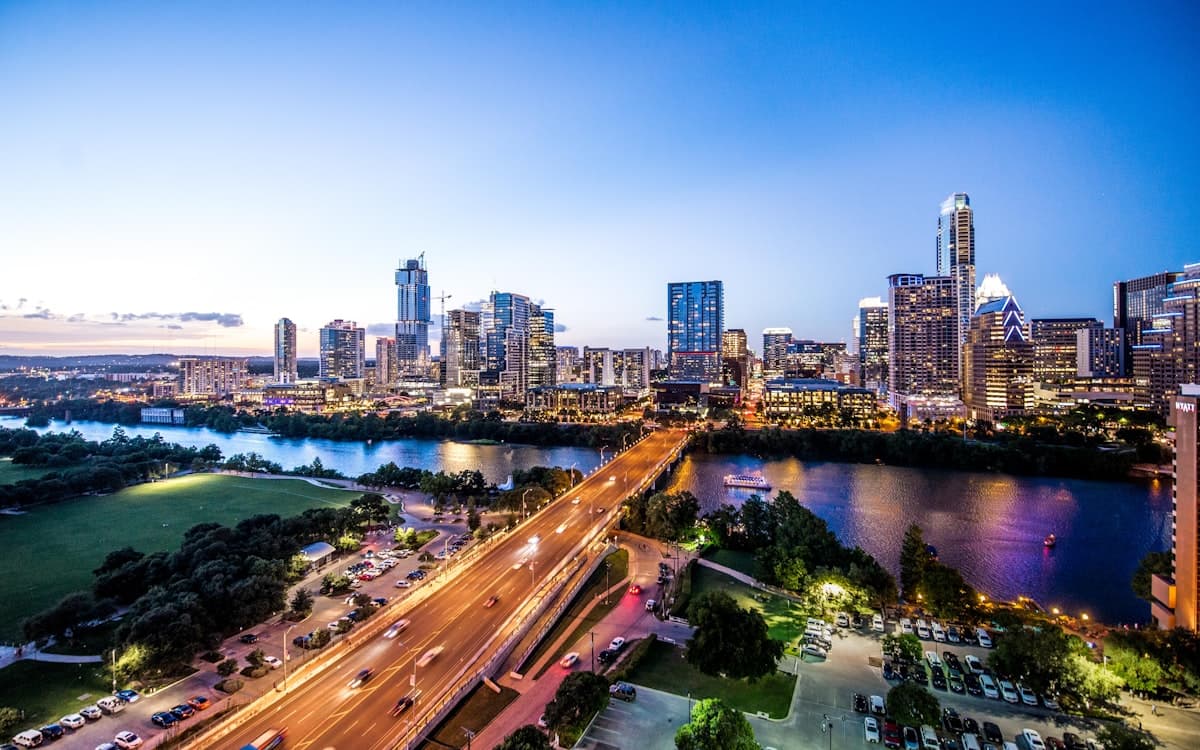 Austin downtown skyline at dusk with Congress Avenue bridge