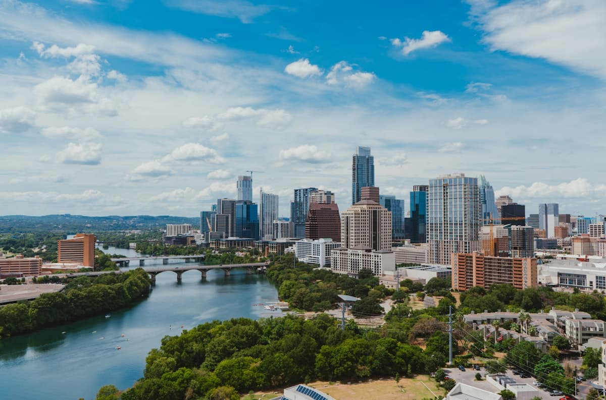 Austin skyline and Lady Bird Lake daytime view with bridges