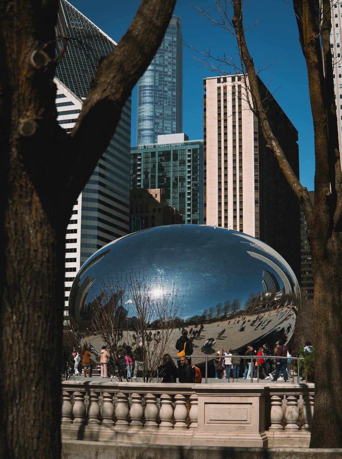 Cloud Gate sculpture (The Bean) in Millennium Park Chicago with skyline reflection