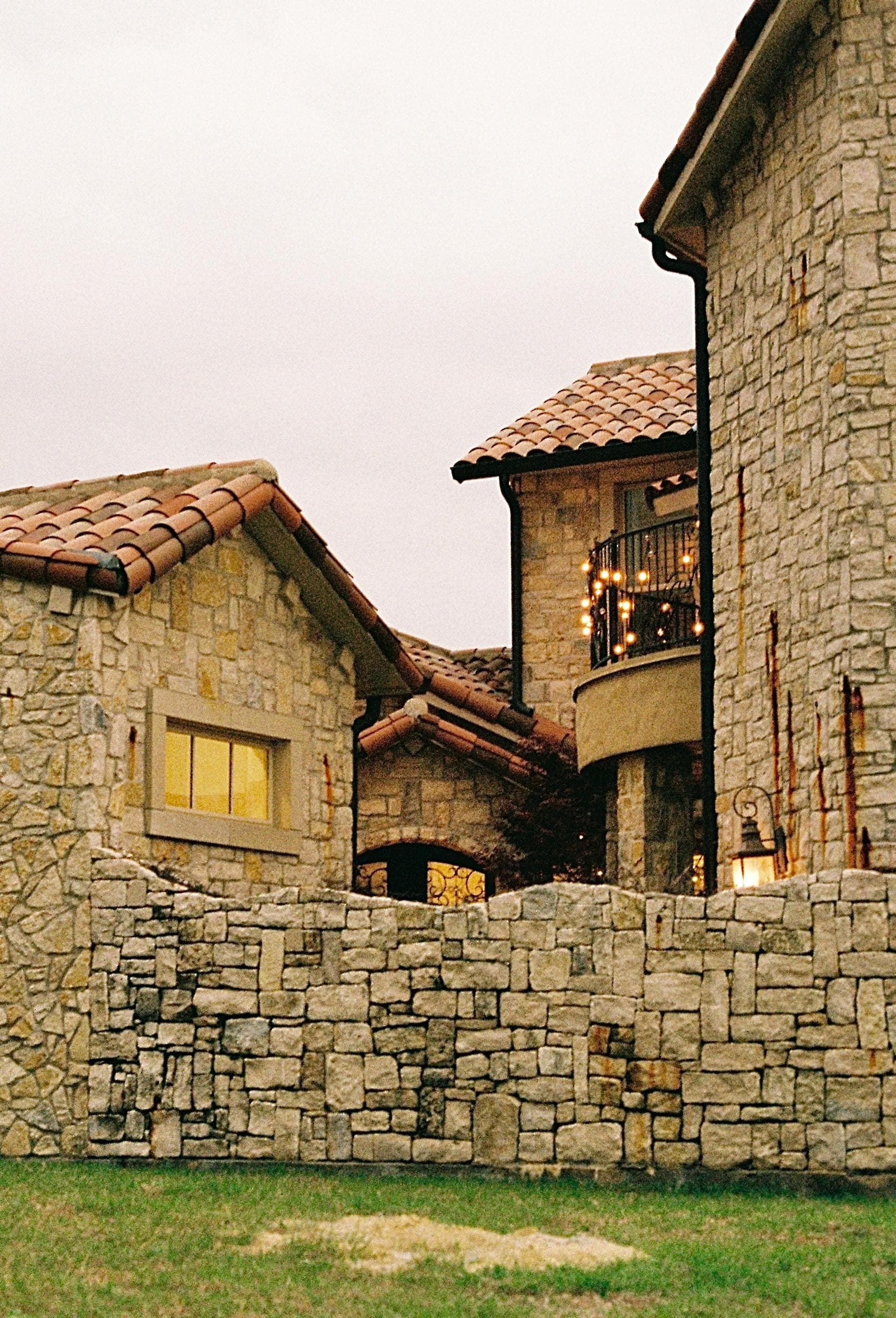 Luxury stone mansion with tile roof in Dallas-Fort Worth area