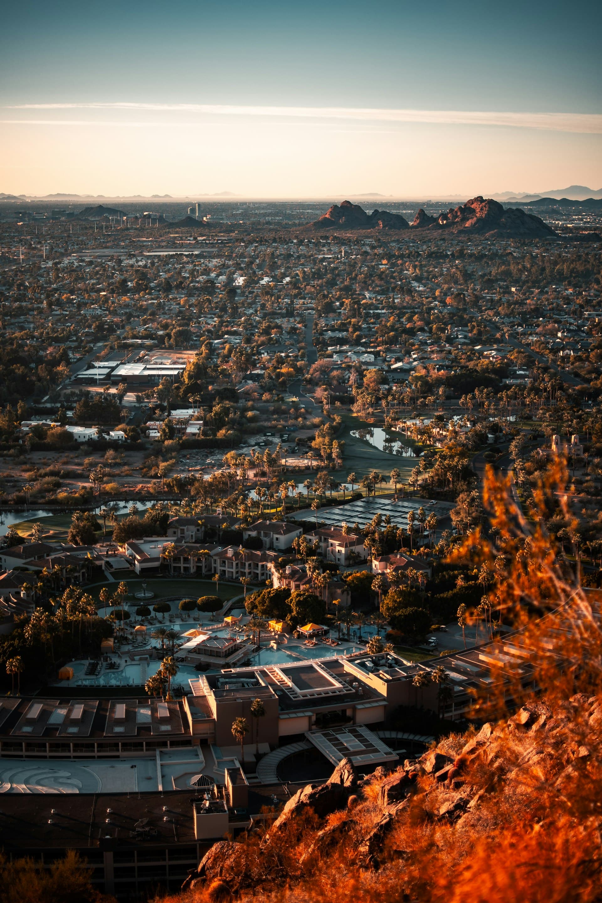 Aerial view of Phoenix Arizona metro area at golden hour with Camelback Mountain