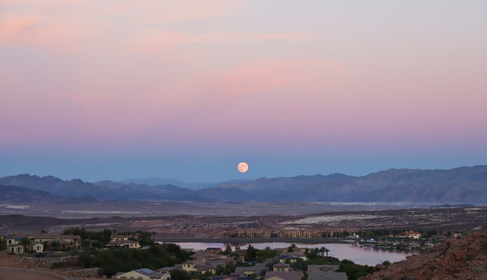 Moonrise over Lake Las Vegas resort community in Henderson Nevada at sunset