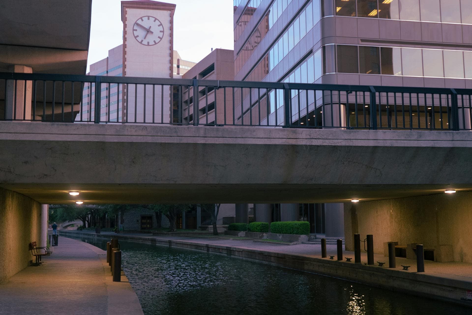 Las Colinas canal with clock tower and modern office buildings in Irving, Texas