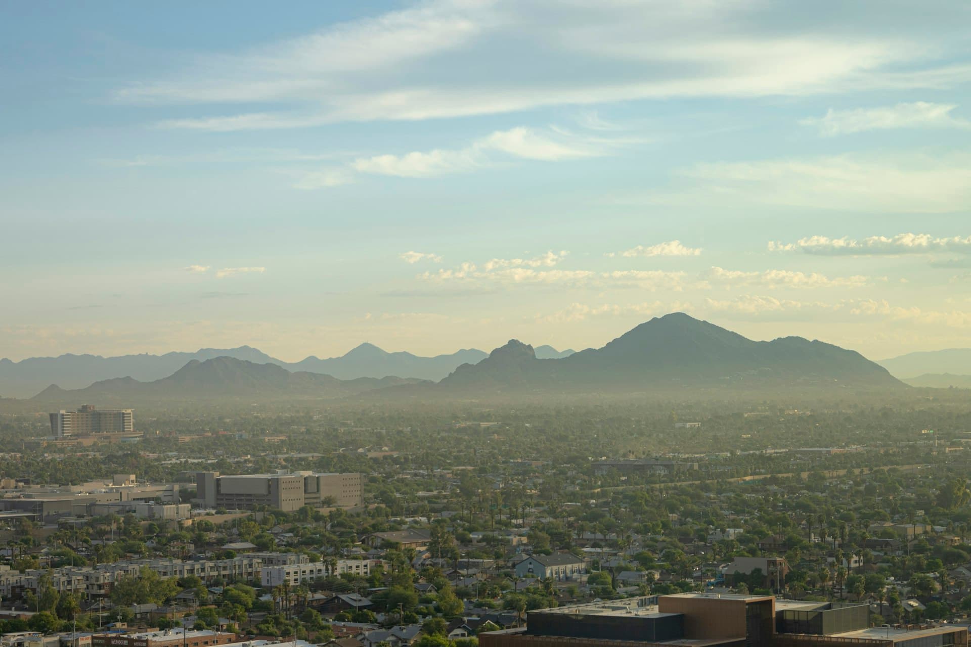 Phoenix valley view with Camelback Mountain showing hazy heat conditions typical of Arizona summers