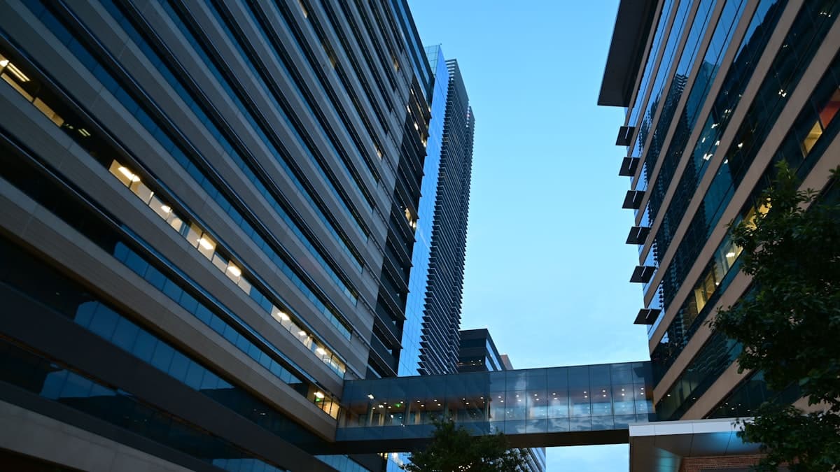 Modern corporate office towers with skywalk in CityLine business district near Plano