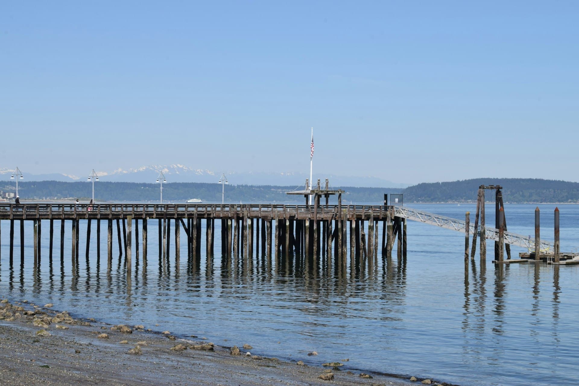 Tacoma waterfront pier on Puget Sound with Olympic Mountains in background