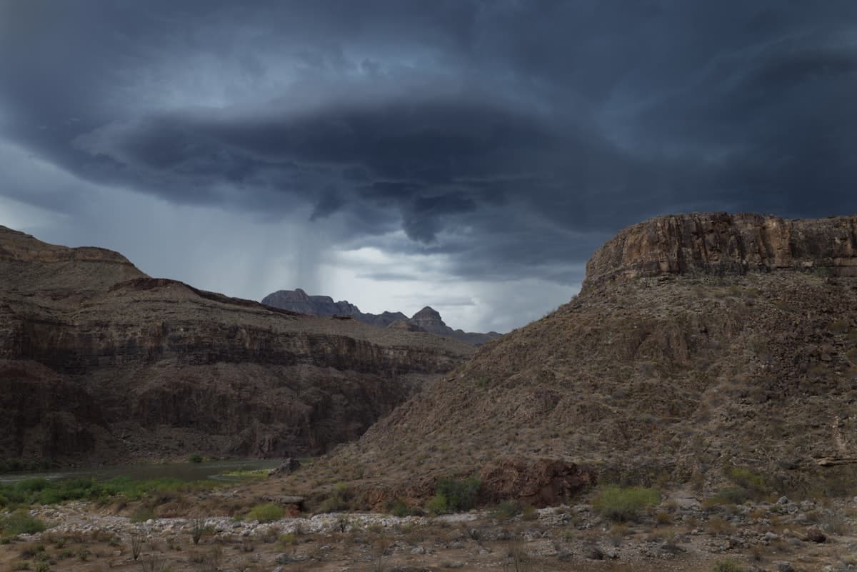 Storm clouds gathering over Arizona desert canyon landscape